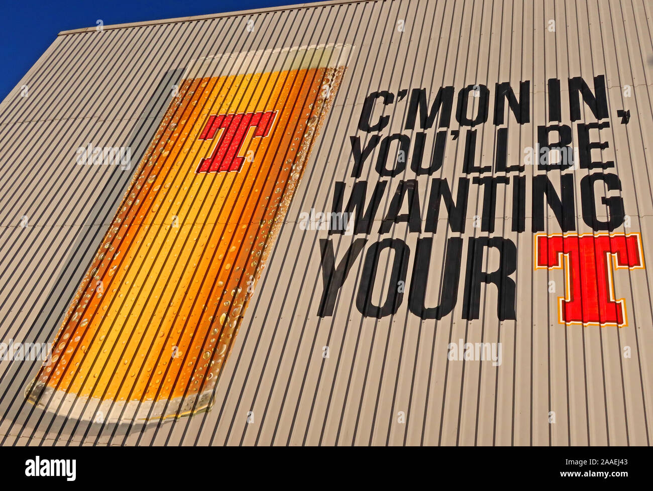 Scotlands favourite beer, Cmon Youll be wanting your T,Tennents lager beer, on side of Wellpark Brewery, 161 Duke St, Glasgow, Scotland, UK,  G31 1JD Stock Photo