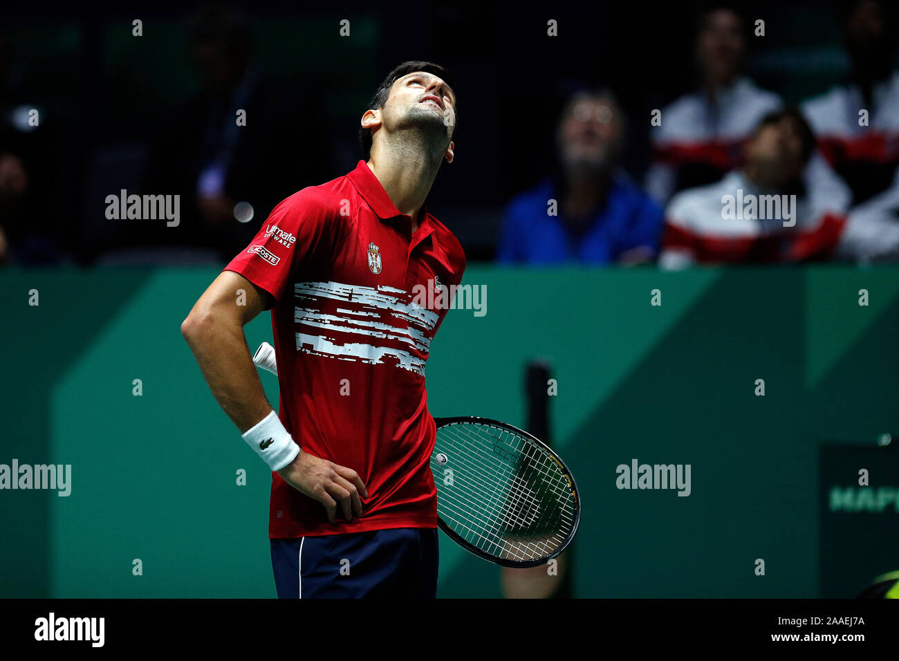 Novak Djokovic of Serbia in action against Benoit Paire of France during Day 4 of the 2019 Davis Cup at La Caja Magica. Stock Photo