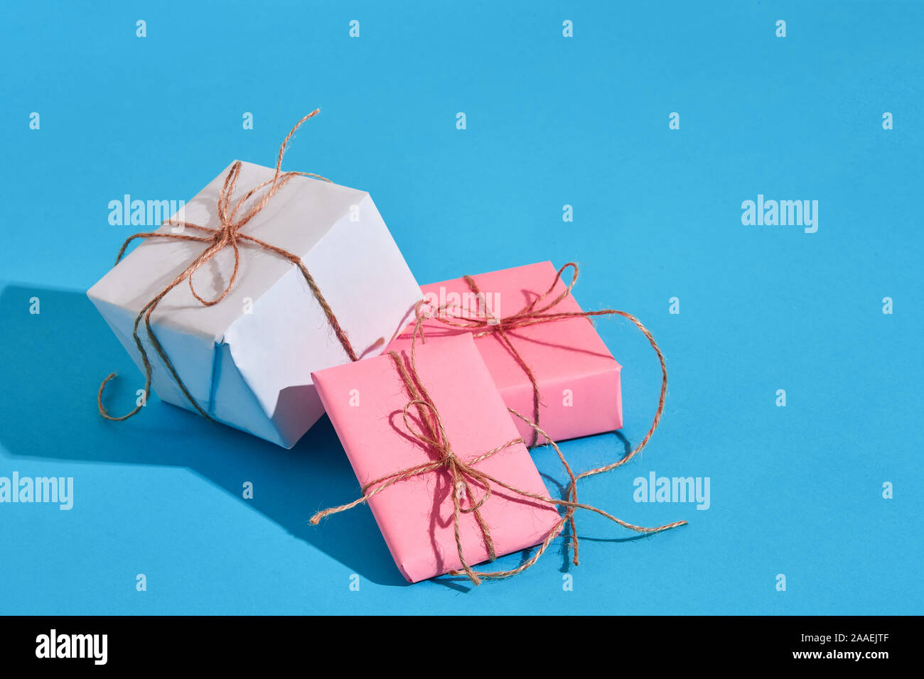 Craft paper wrapped present boxes craft rope bow ribbon with sha Stock