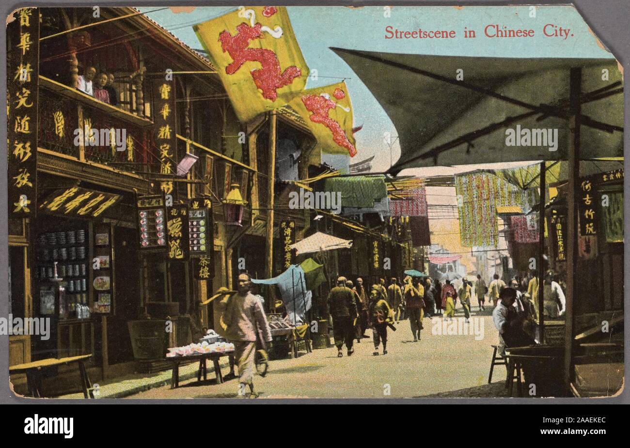 Illustrated postcard of a busy commercial street with colorful storefronts, banners and canopies in Shanghai, China, published by Chrom, 1912. Edit. Kingshill. From the New York Public Library. () Stock Photo
