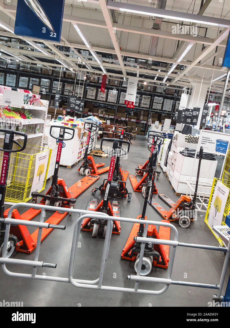 manual pallet trucks parked in furniture store Ikea Stock Photo