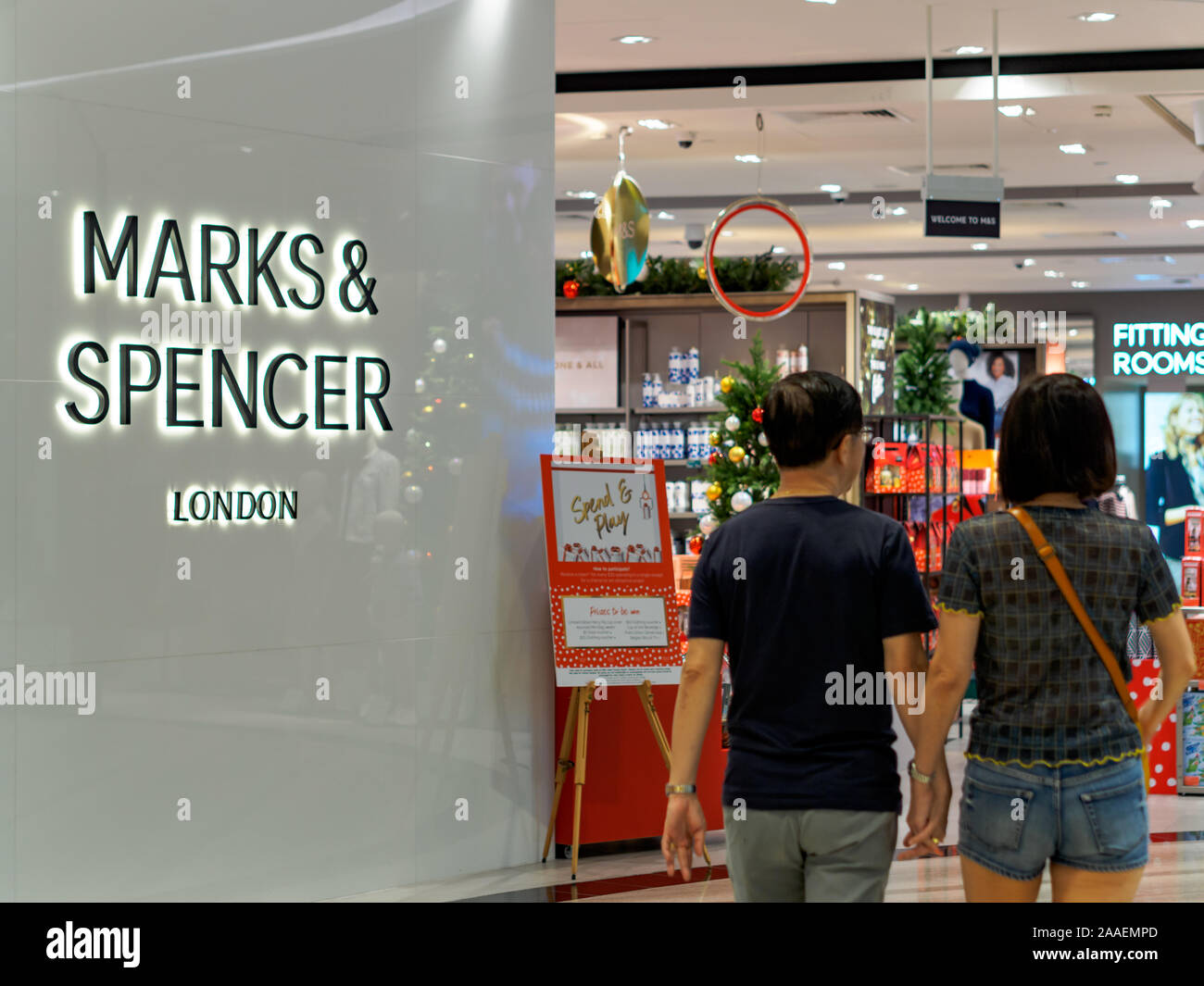 SINGAPORE - 17 NOV 2019 - Shoppers walk past a Marks & Spencer store at Jewel, Changi Airport, Singapore Stock Photo