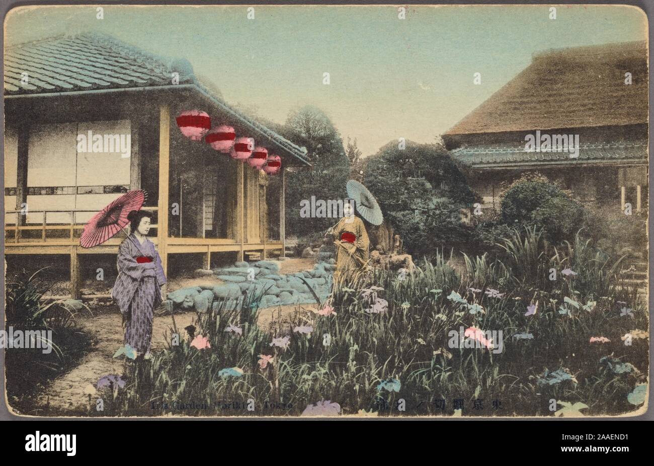 Illustrated postcard of two Japanese women in traditional kimono with parasols walking in a garden, with Japanese-style houses adorned with paper lanterns behind them, Japan, 1912. From the New York Public Library. () Stock Photo