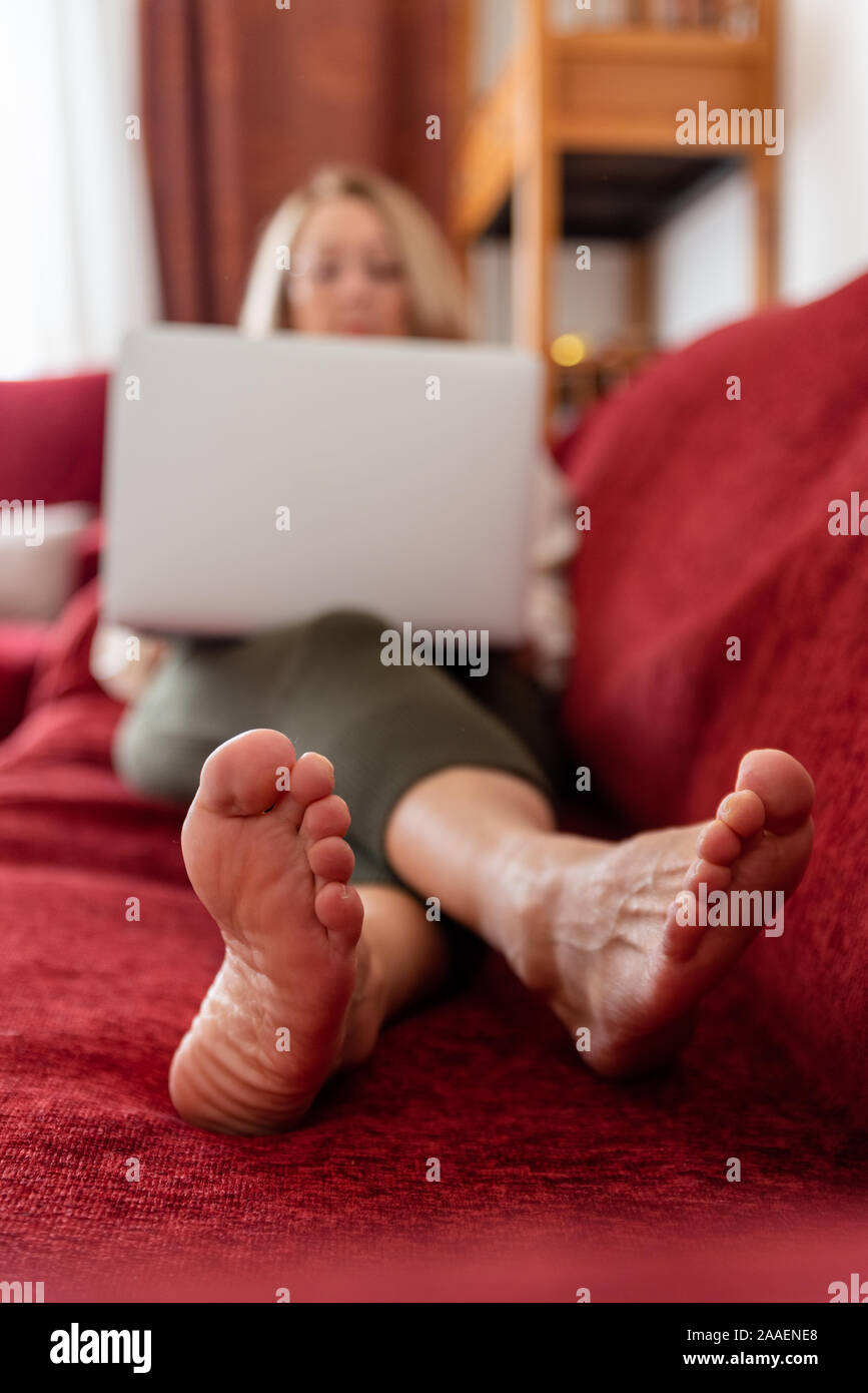 Elegant mature woman using computer at home Stock Photo