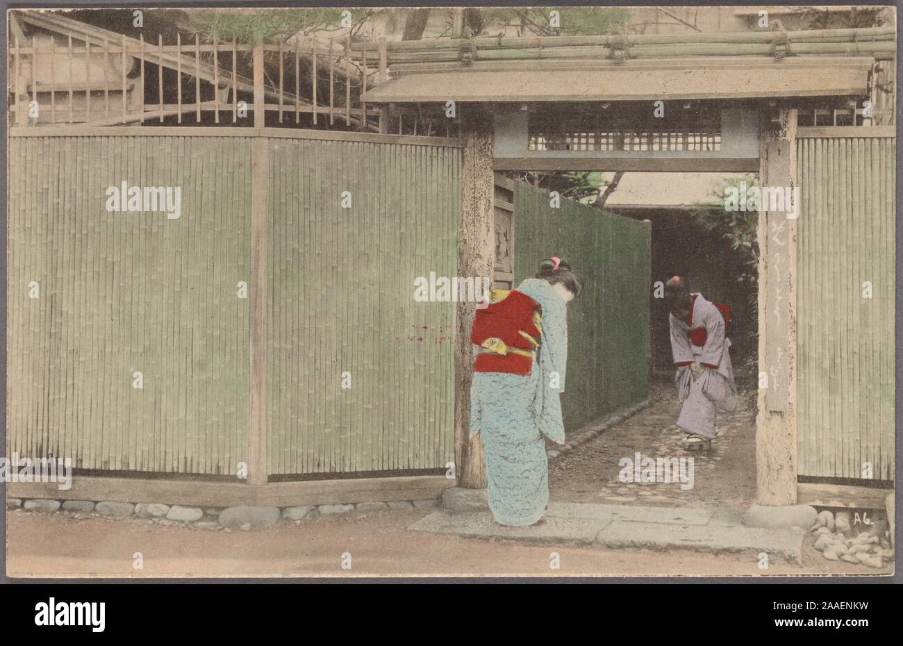 Illustrated postcard featuring two Japanese women wearing traditional kimono, standing in an entryway between two bamboo fences bowing to each other, Japan, 1920. From the New York Public Library. () Stock Photo