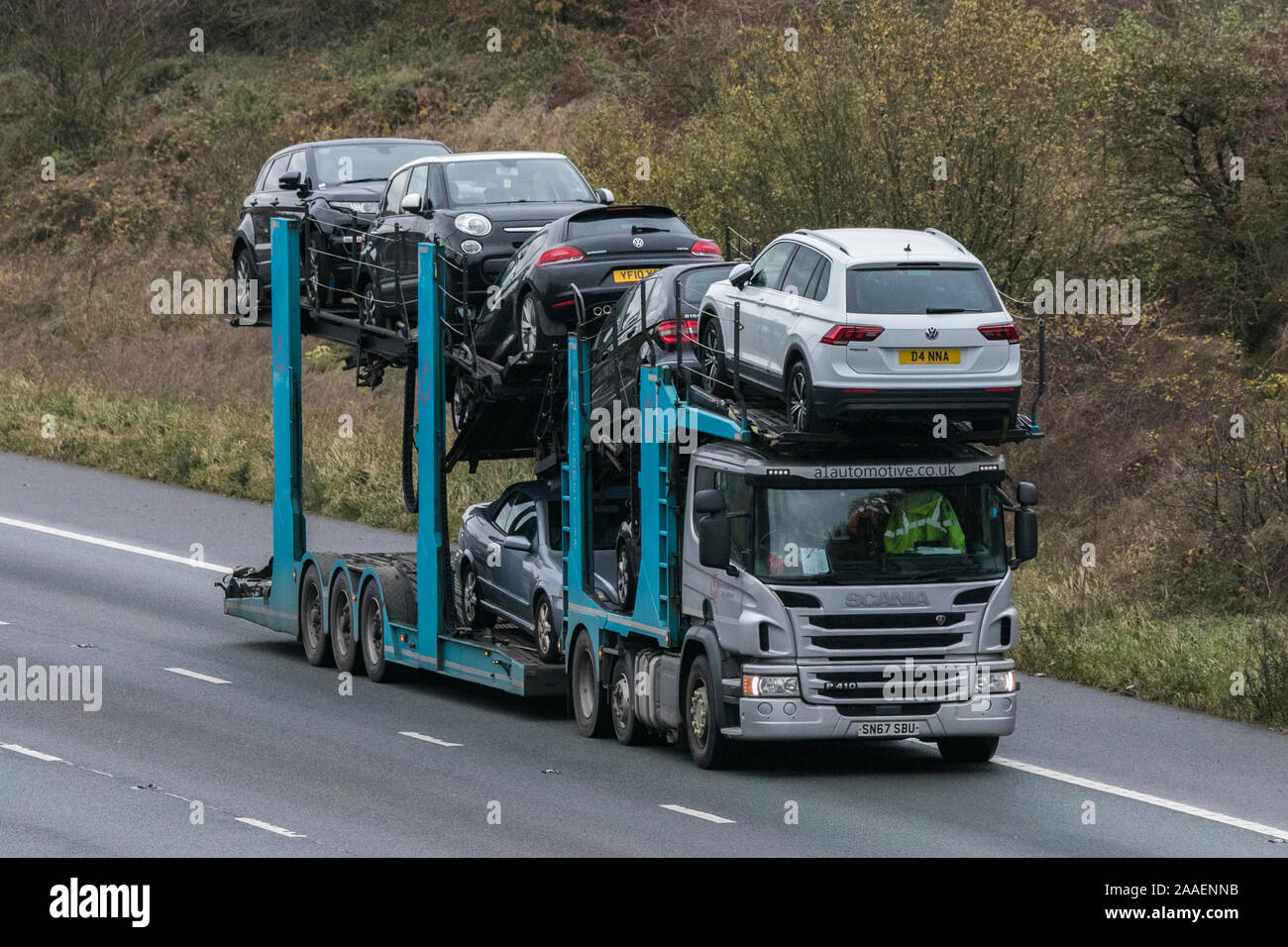 Vehicular traffic, transport, modern vehicles, saloon cars, south-bound motoring on the M61 motorway, UK Stock Photo