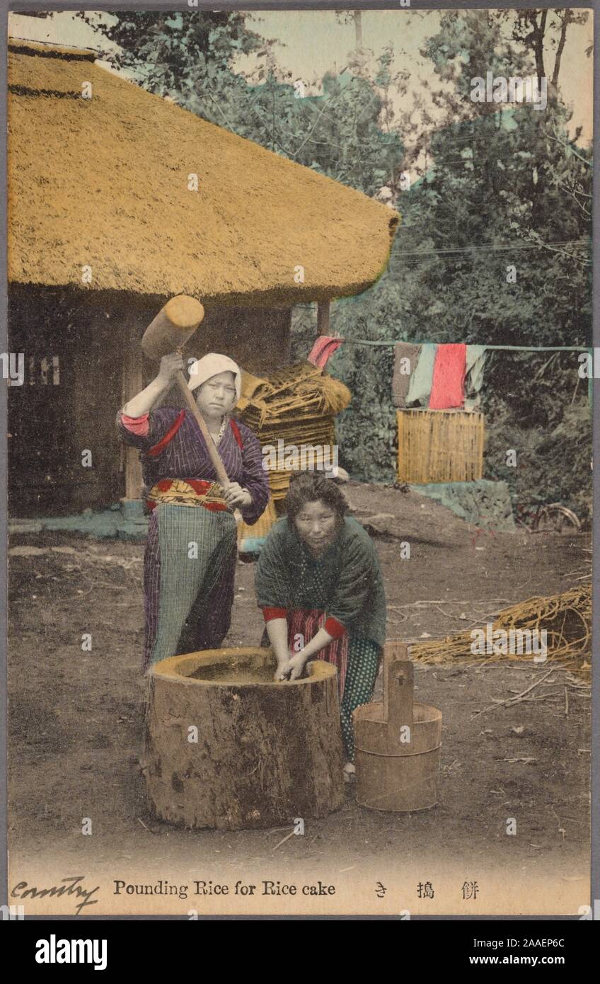 Illustrated postcard of two Japanese women pounding rice with a mallet in front of a thatched roof house in a rural area, Japan, 1920. From the New York Public Library. () Stock Photo