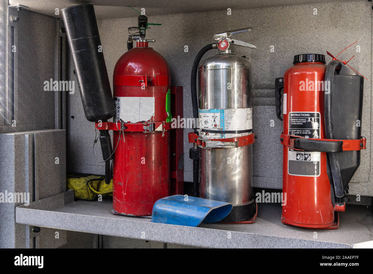 Fire extinguisher in fire truck side compartment. Stock Photo