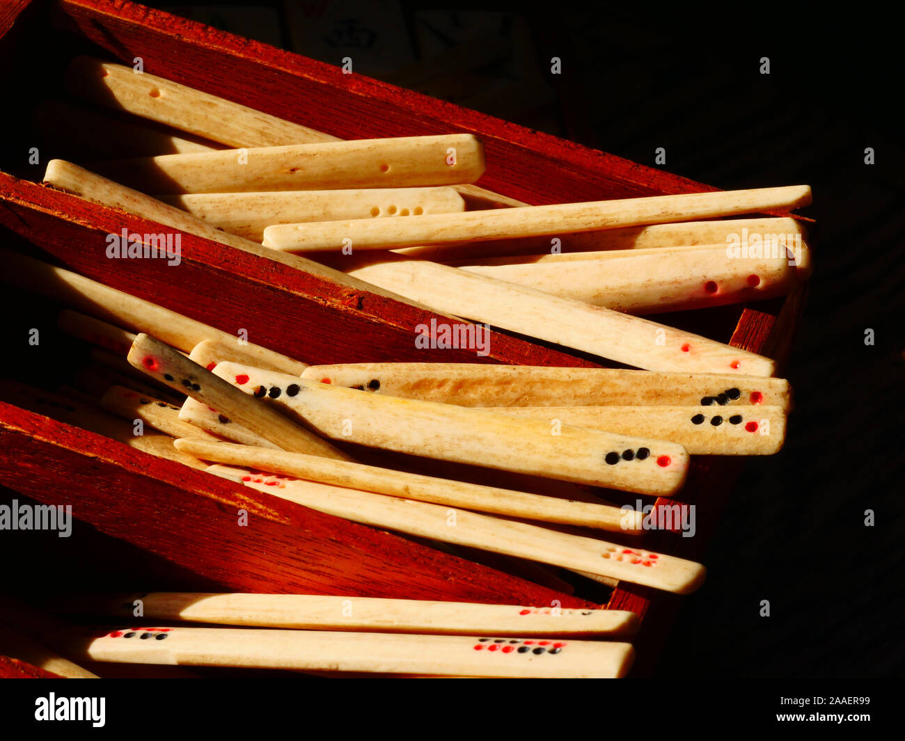 Mahjong antique bone scoring rods in wooden draw Stock Photo - Alamy