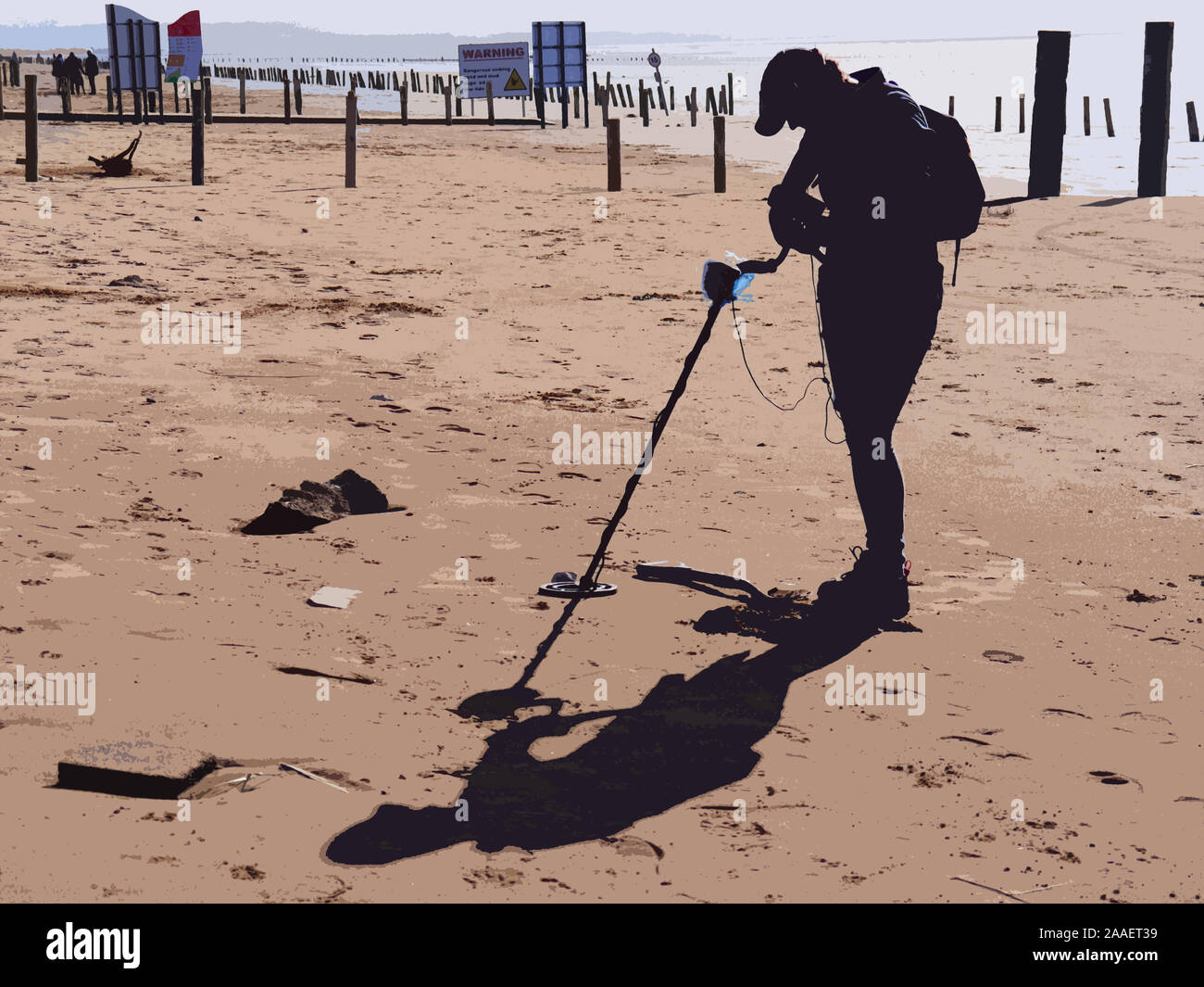 Woman, metal detecting on a Brean beach Somerset UK, silhouette, cutout
