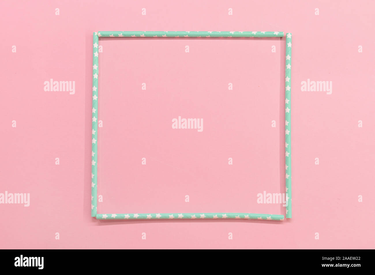 square frame with Colorful Paper coctail tubes on the pink background. Eco friendly. Zero Waste. Isolated Stock Photo