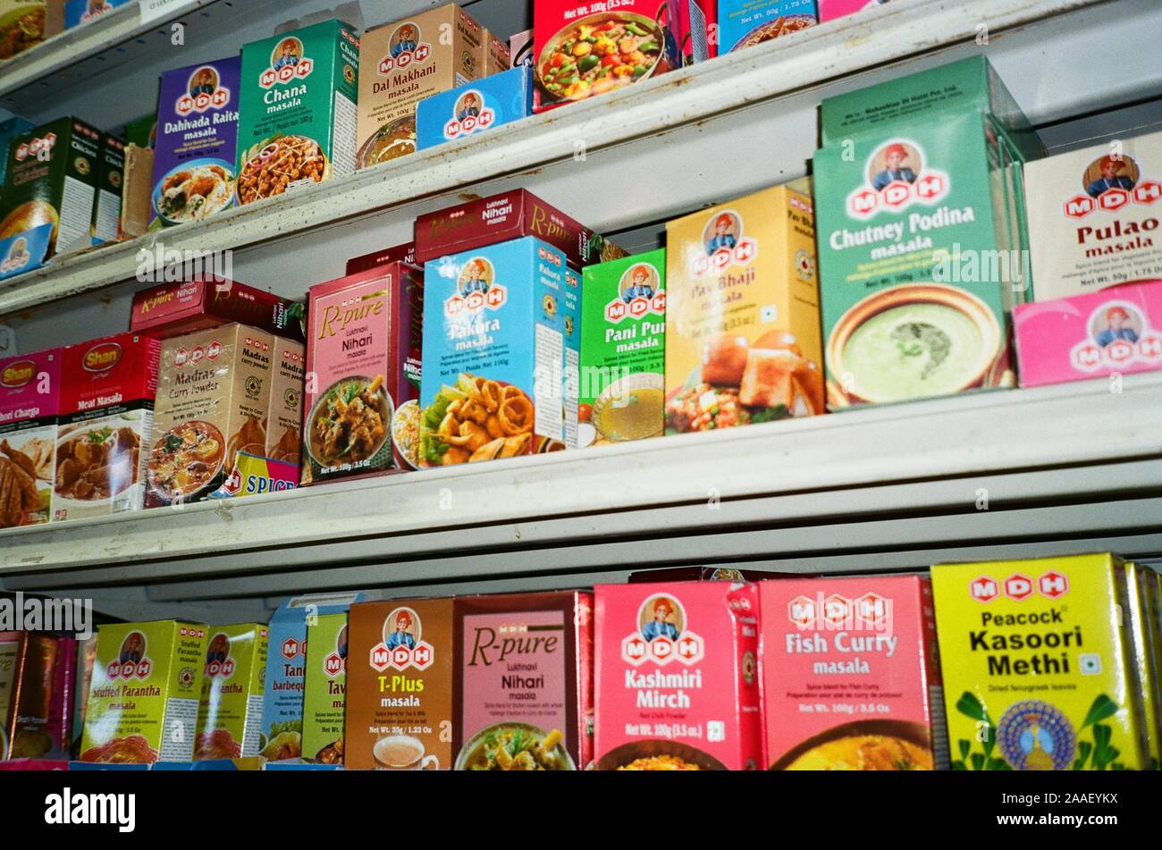 Prepared food items are arranged on a shelf at an Indian grocery store