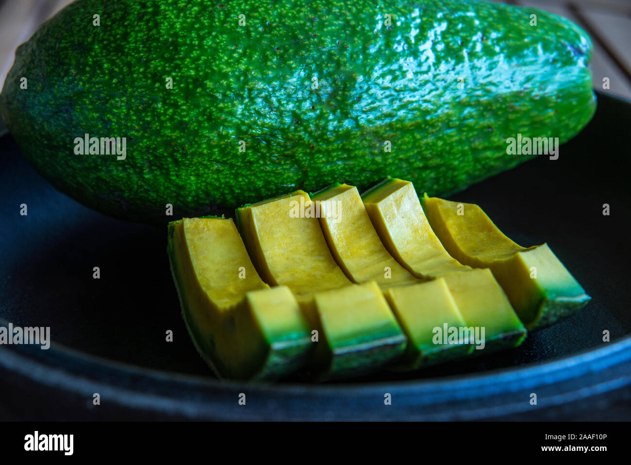 Freshly cut sliced Cuban avocado Stock Photo