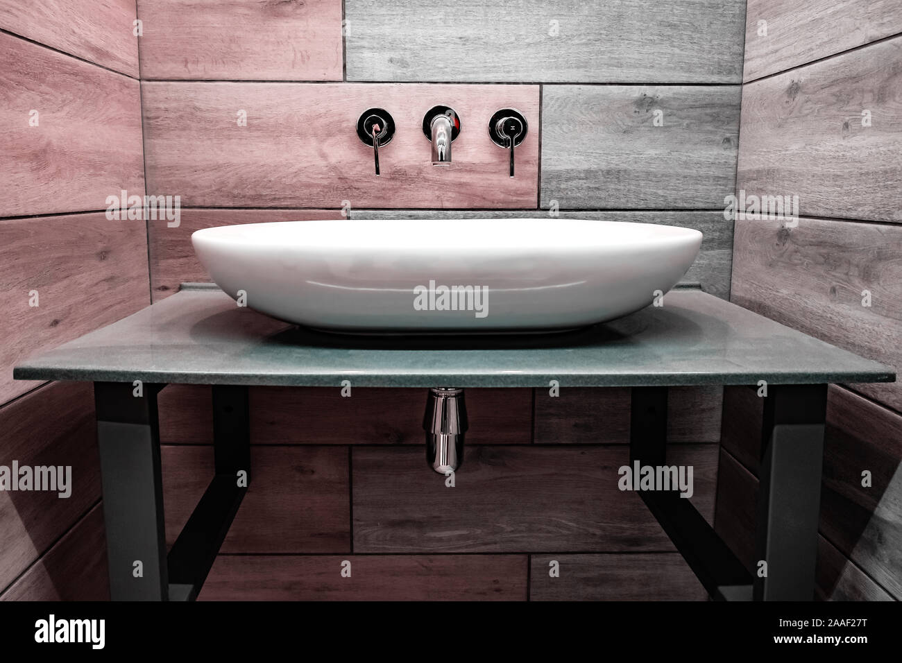 Classic modern white washbasins with chrome water tap and soap dish Stock Photo