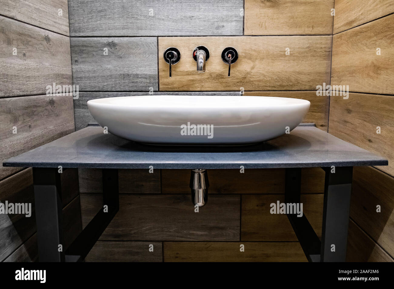 Classic modern white washbasins with chrome water tap and soap dish Stock Photo
