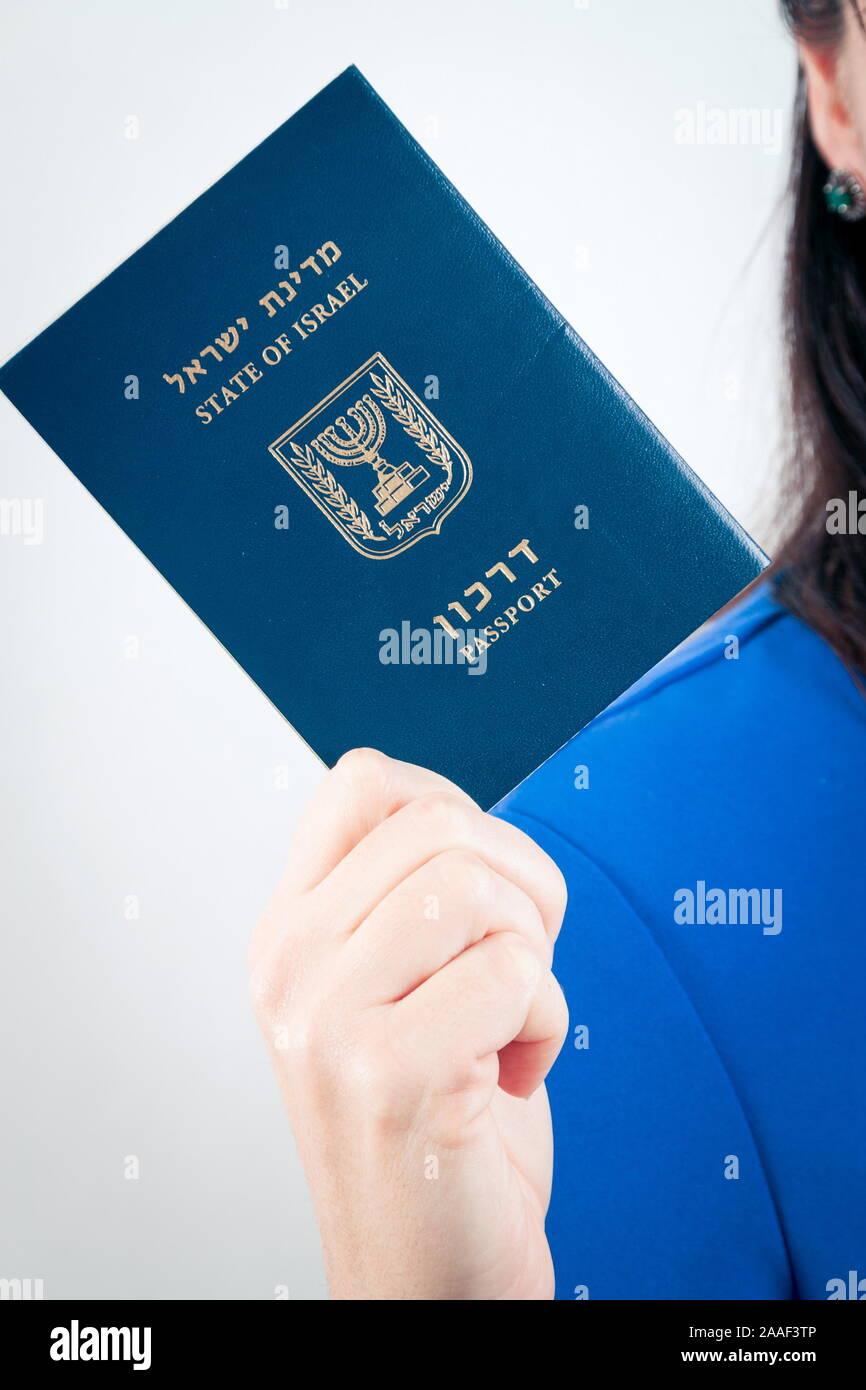 Israel passport in the hand of woman Stock Photo Alamy