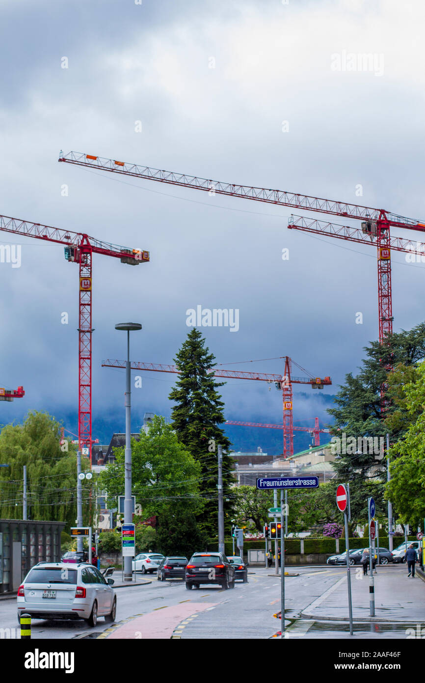 Zurich street. Construction cranes. Cars Stock Photo