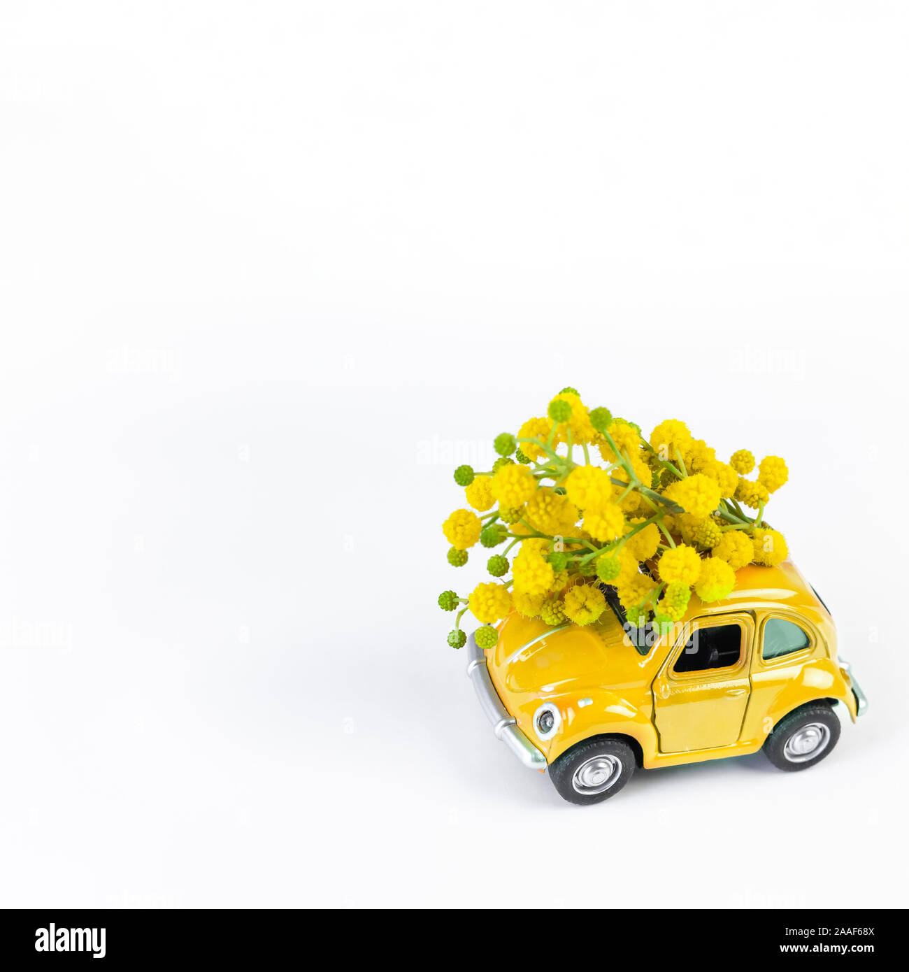 Moscow Russia February 23 2019 8 March International Women S Day Card With Toy Model Retro Car Delivering Bouquet Of Mimosa Flowers On White Back Stock Photo Alamy