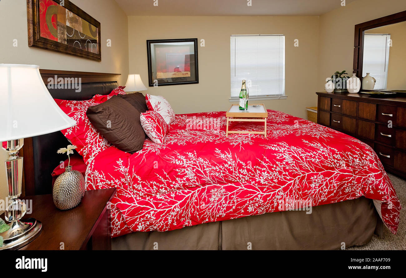 A bed tray sits on a bed at Four Seasons apartments in Mobile, Alabama. The apartment complex is owned and operated by Sealy Management Company. Stock Photo