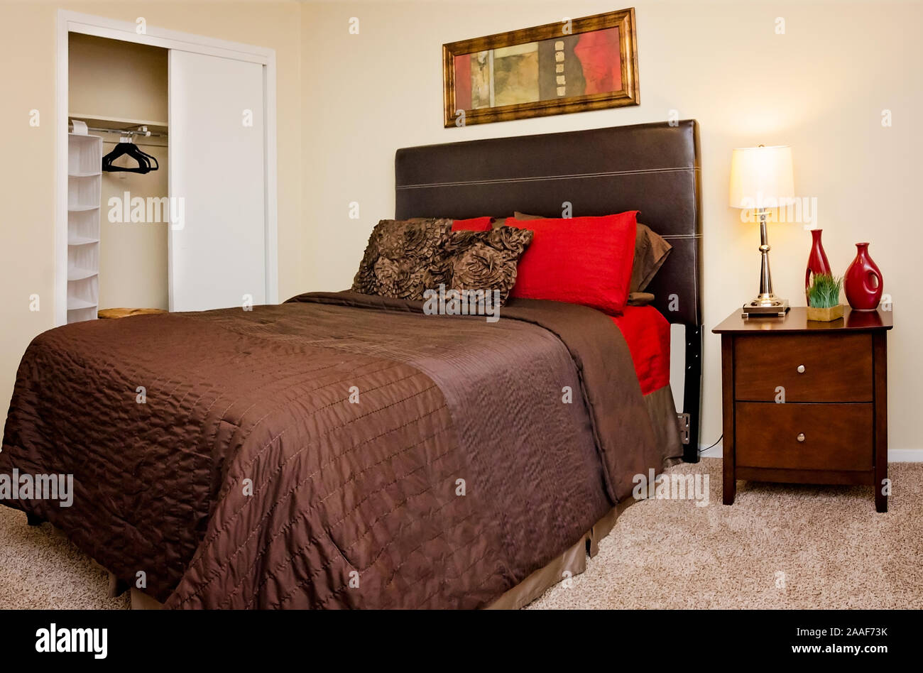 A Small Closet Is Included In A One Bedroom Apartment At
