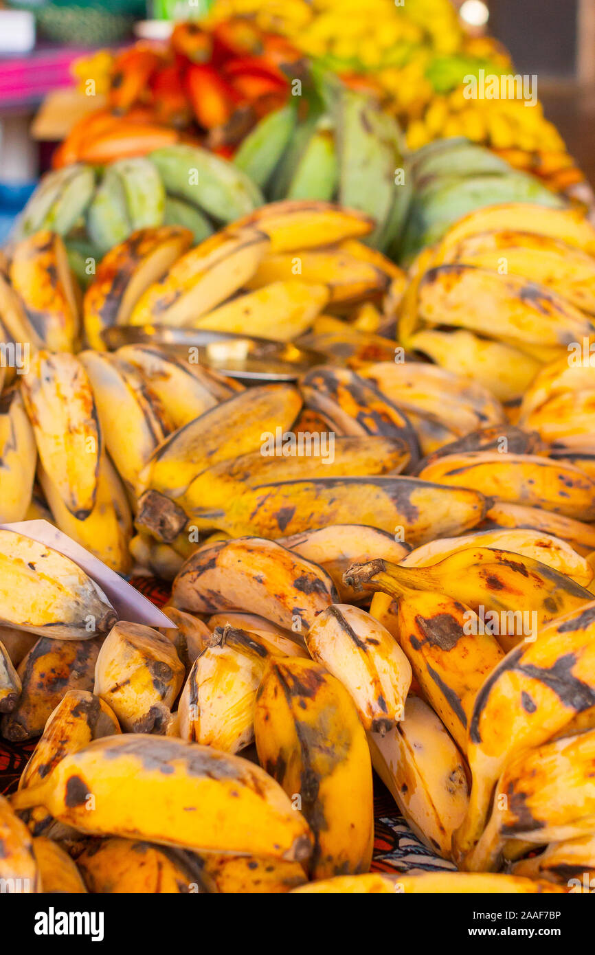 Different types and species of banana. Red, yellow, green bananas in the asian supermarket. Stock Photo