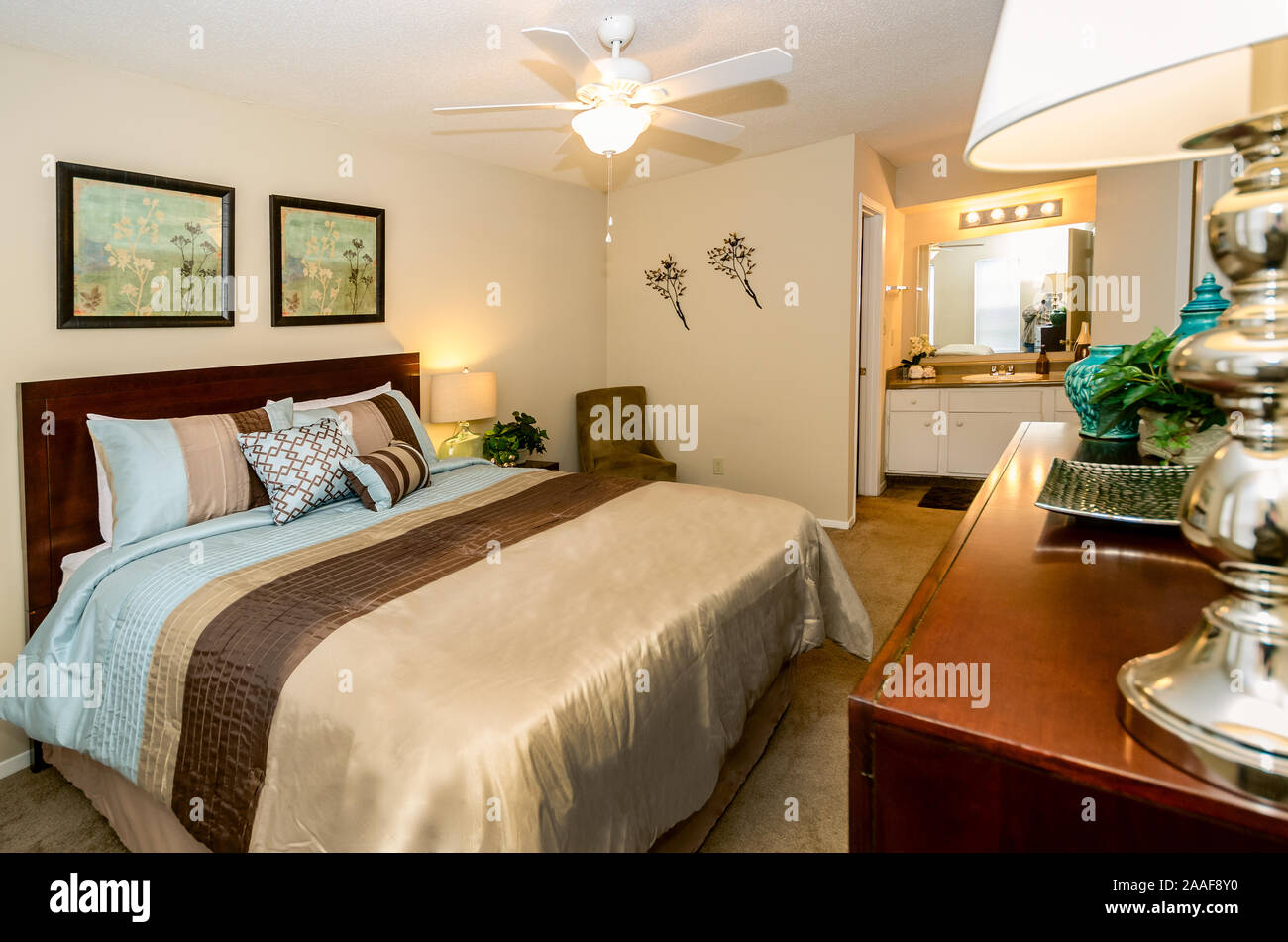 A furnished bedroom is shown at Robinwood Apartments in Mobile, Alabama. Stock Photo