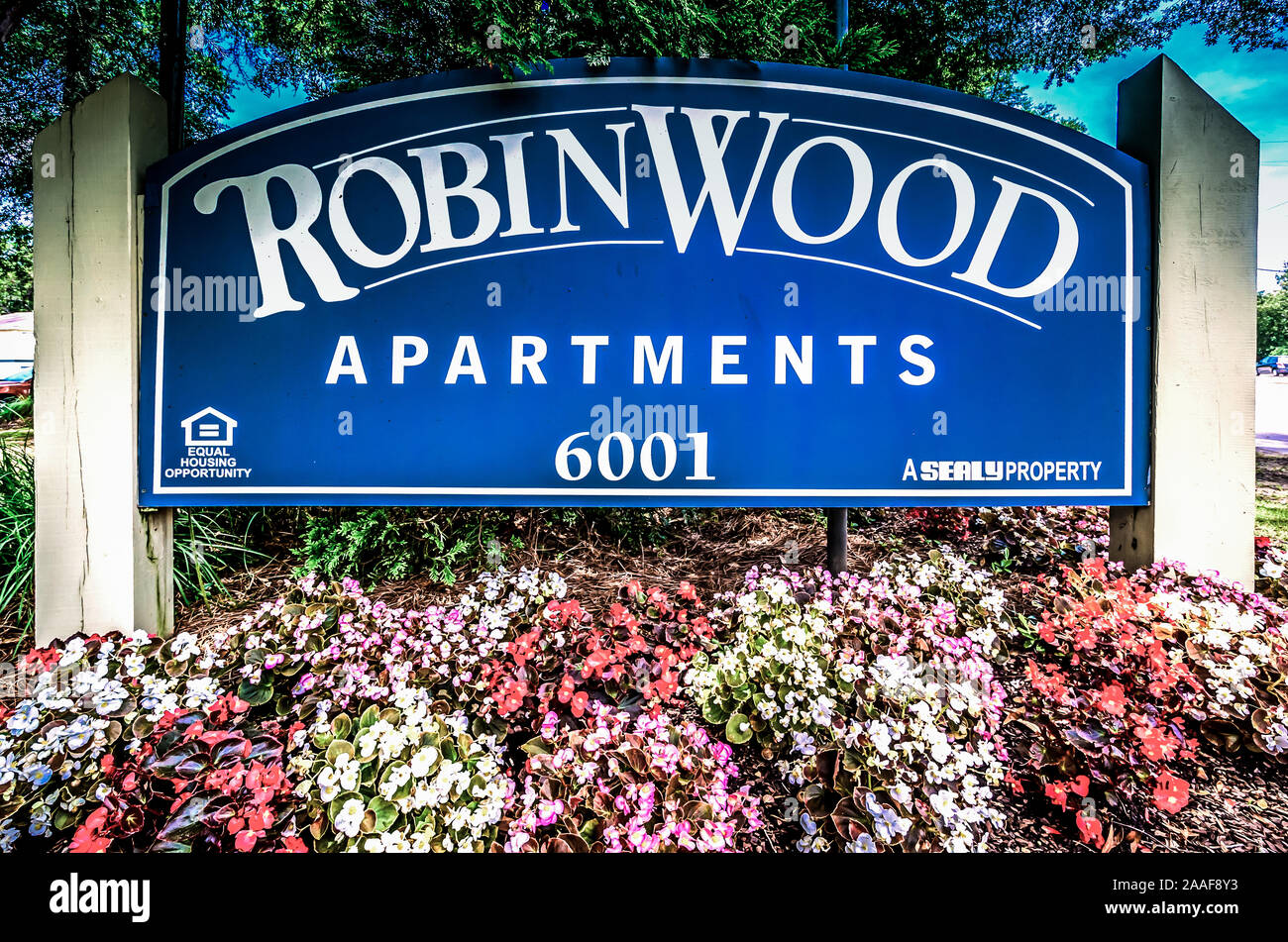Flowers decorate the sign outside Robinwood Apartments, June 11, 2015, in Mobile, Alabama. Stock Photo