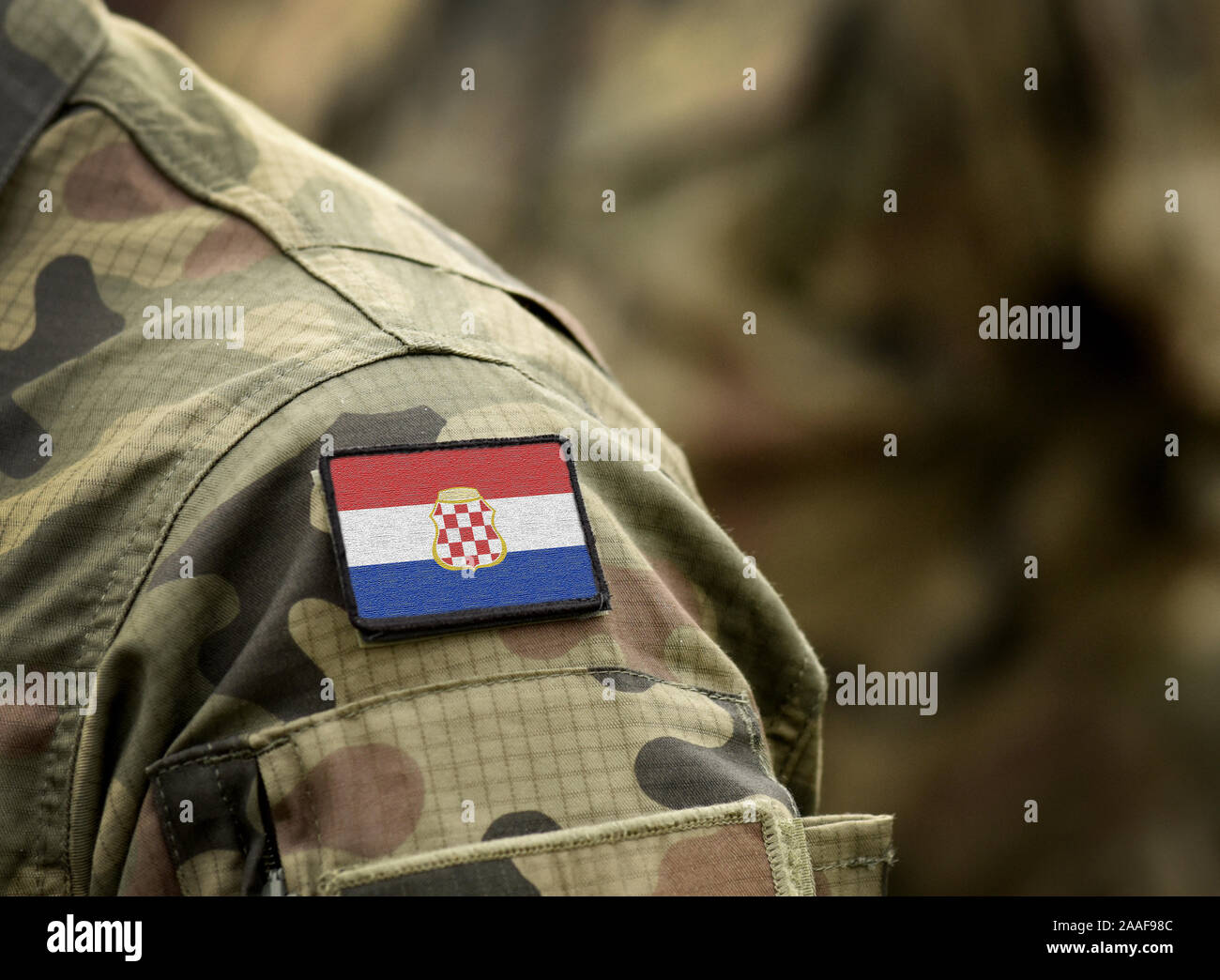 Flag of Croatian Republic of Herzeg-Bosnia (1991–1996) on military uniform. Army, armed forces, soldiers. Collage. Stock Photo