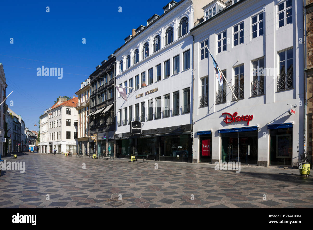 A row of department stores on Stroget Street early morning in Copenhagen, Denmark Stock Photo