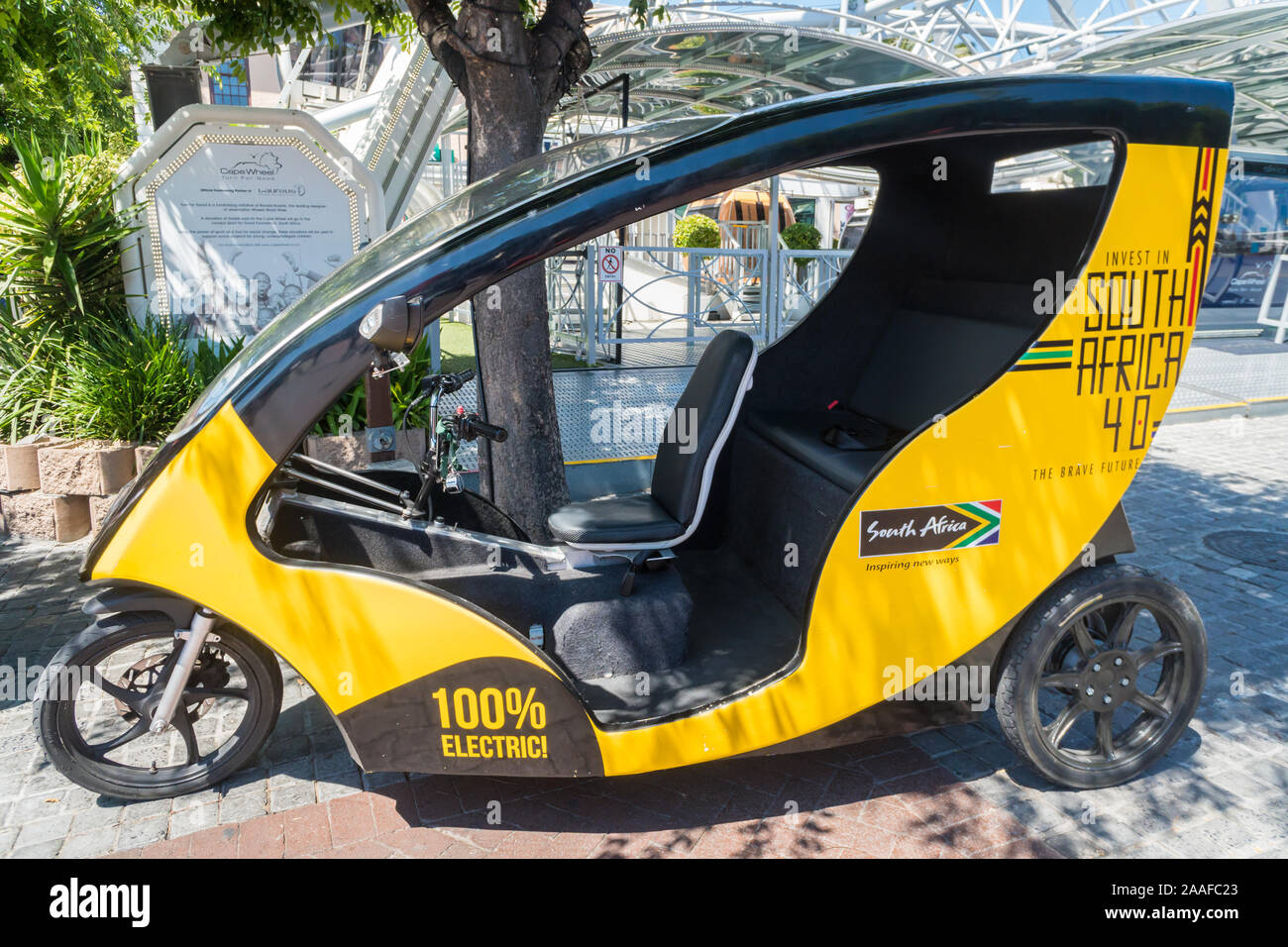 electric tuk tuk vehicle, environmentally friendly to the environment with no people or passengers at the V&A Waterfront in Cape Town, South Africa Stock Photo