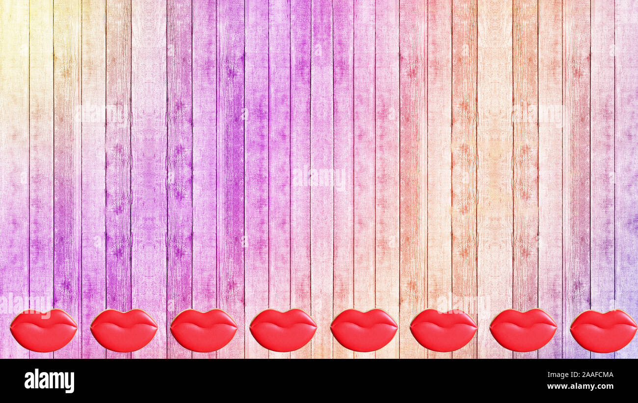 Valentine's day. Cookies in the shape of lips and heart on a wooden colorful background. Stock Photo