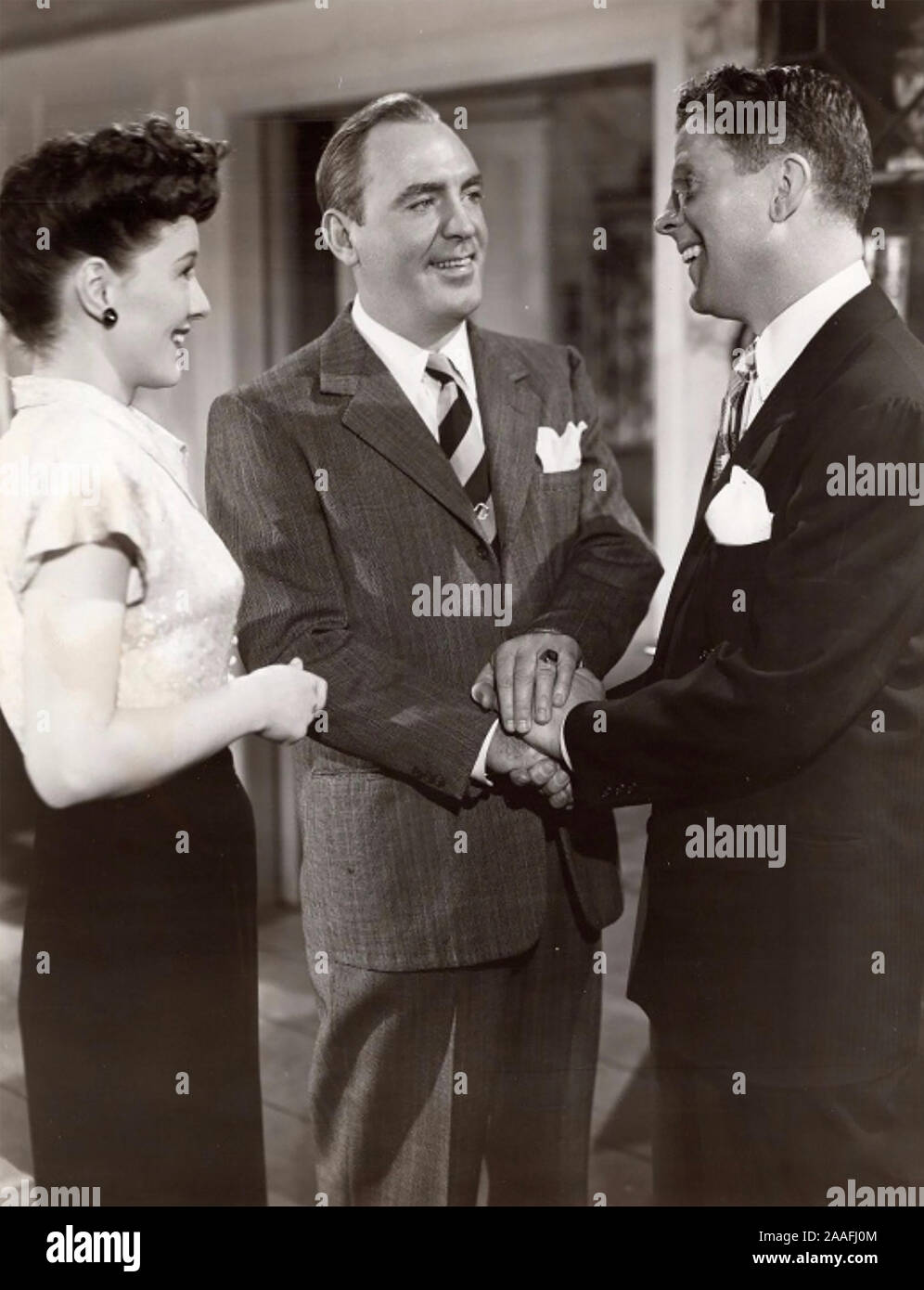 MAN ALIVE 1945 RKO Radio Pictures film with from left: Ellen Drew, Pat O'Brien, Rudy Vallée Stock Photo