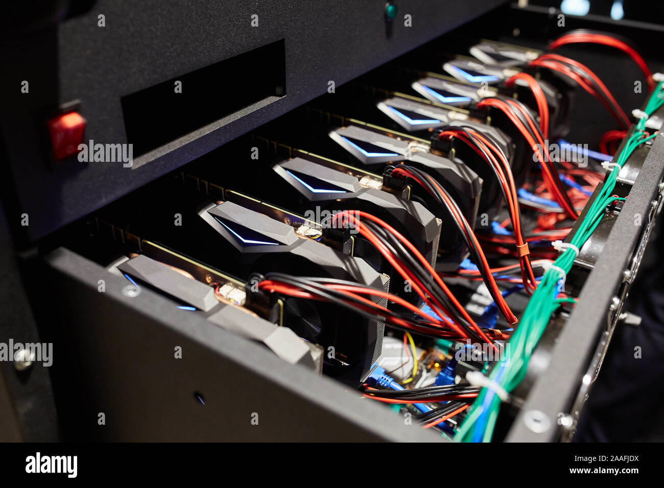 Crypto currency ethereum mining equipment rig - lots of gpu cards on  mainboard. Graphics processing units connected to motherboard with cables.  Server Stock Photo - Alamy
