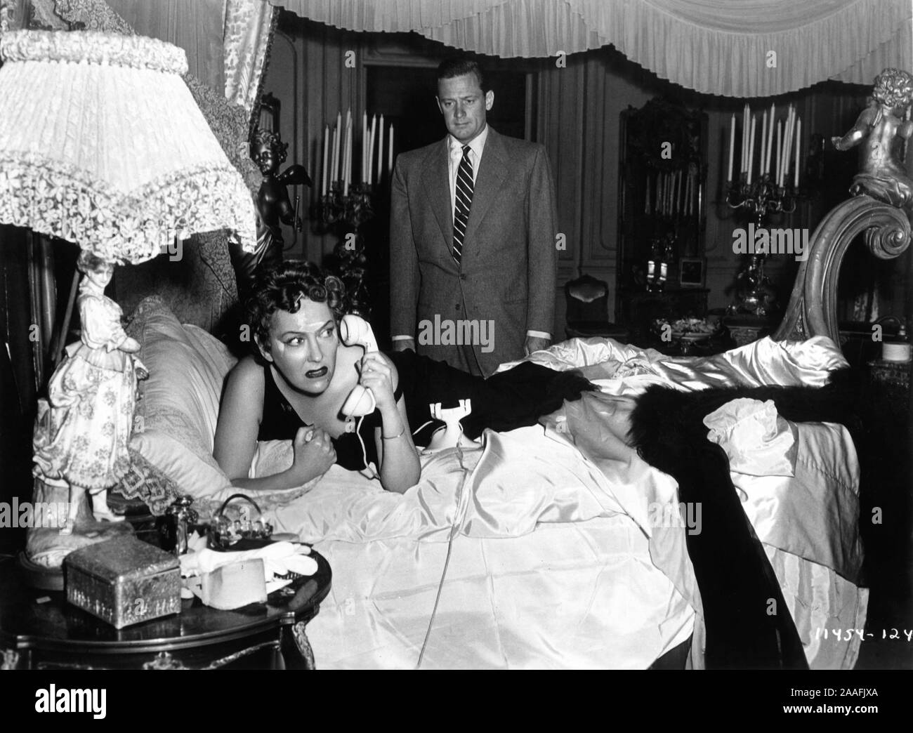 GLORIA SWANSON as Norma Desmond and WILLIAM HOLDEN as Joe Gillis in SUNSET BOULEVARD 1950 director BILLY WILDER writers CHARLES BRACKETT BILLY WILDER and D. M. MARSHMAN Jr Costume design EDITH HEAD Paramount Pictures Stock Photo
