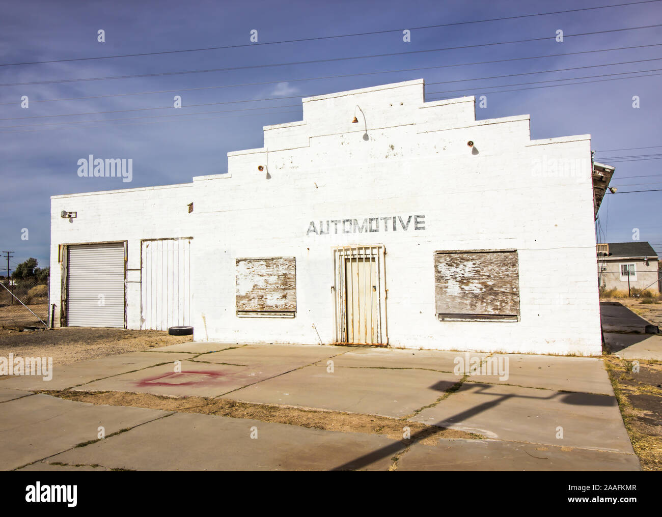 Abandoned Auto Garage With Boarded Up Windows Stock Photo