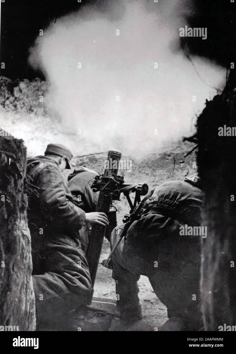 German Soldiers fire a Mortar at night on the Eastern Front 1945 . World War Two B/W photo from German Press 1945 Stock Photo