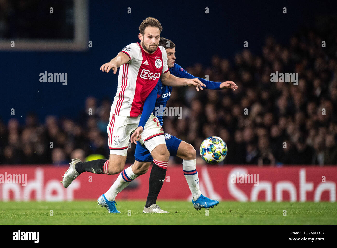 LONDON, ENGLAND - NOVEMBER 05: Christian Pulisic of   Chelsea FC and Daley Blind of AFC Ajax in action during the UEFA Champions League group H match Stock Photo