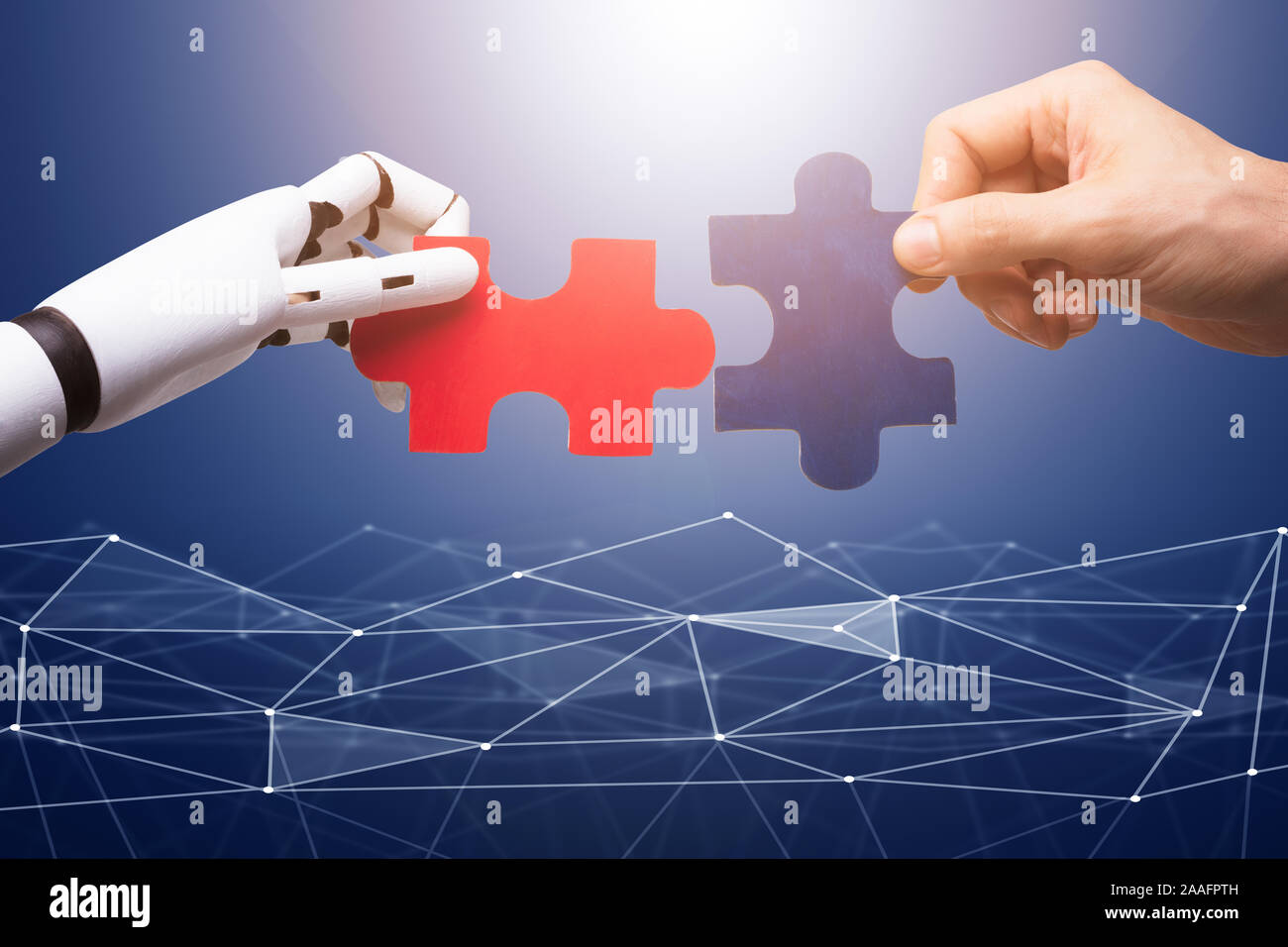 Robot And Man's Hand Joining The Red And Blue Jigsaw Pieces On ...
