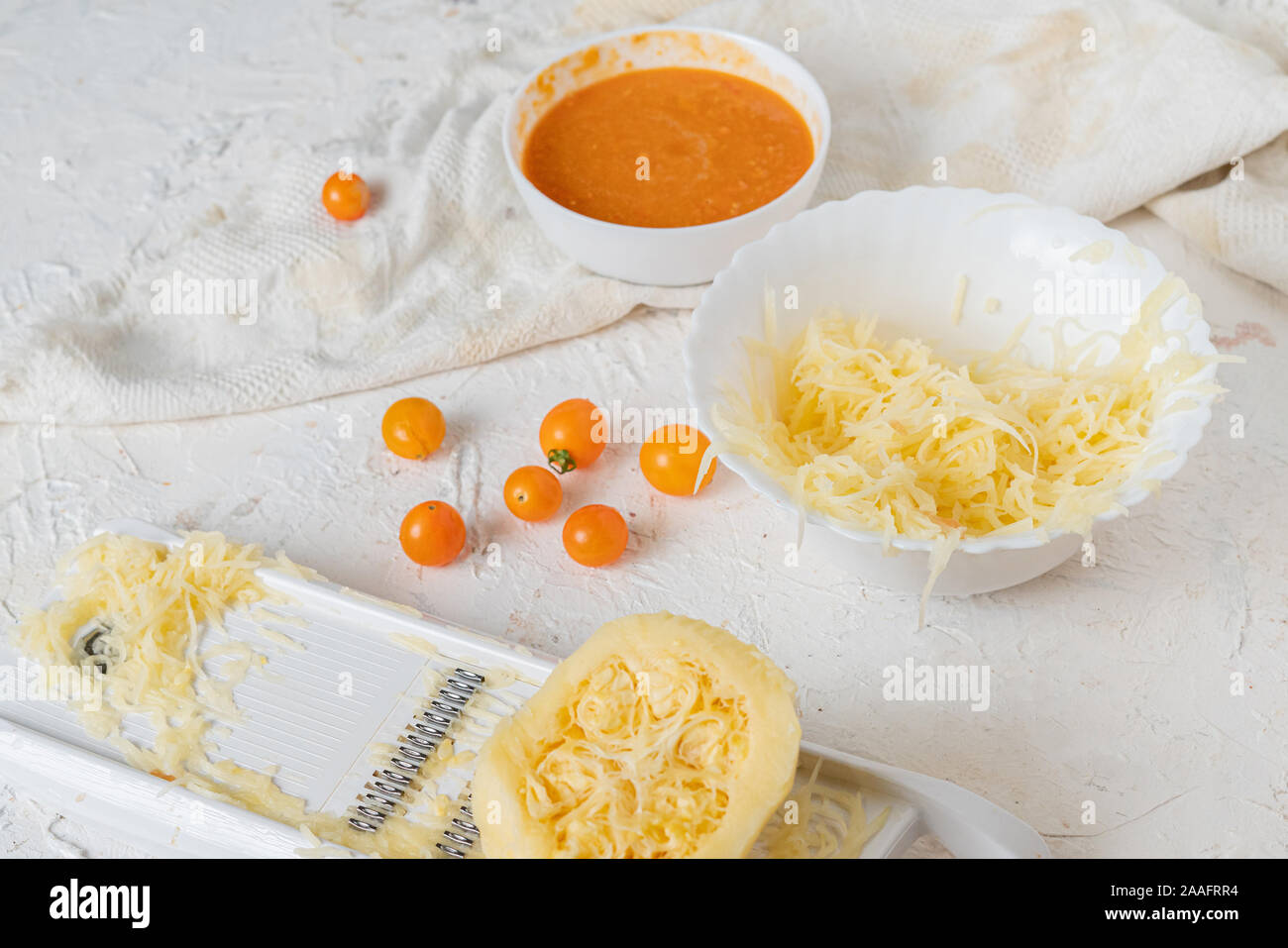 process of making and cooking the cut zucchini pasta spaghetti on the