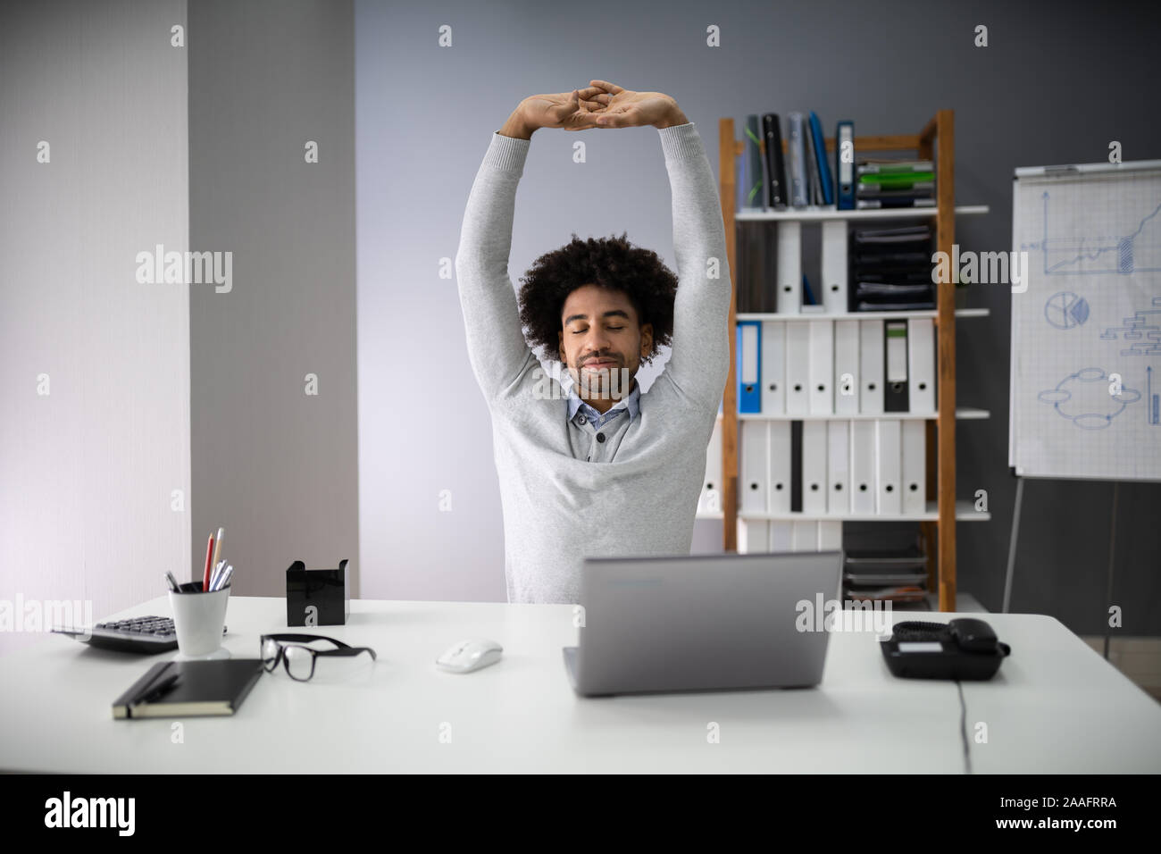 Man stretching arms african hi-res stock photography and images - Alamy