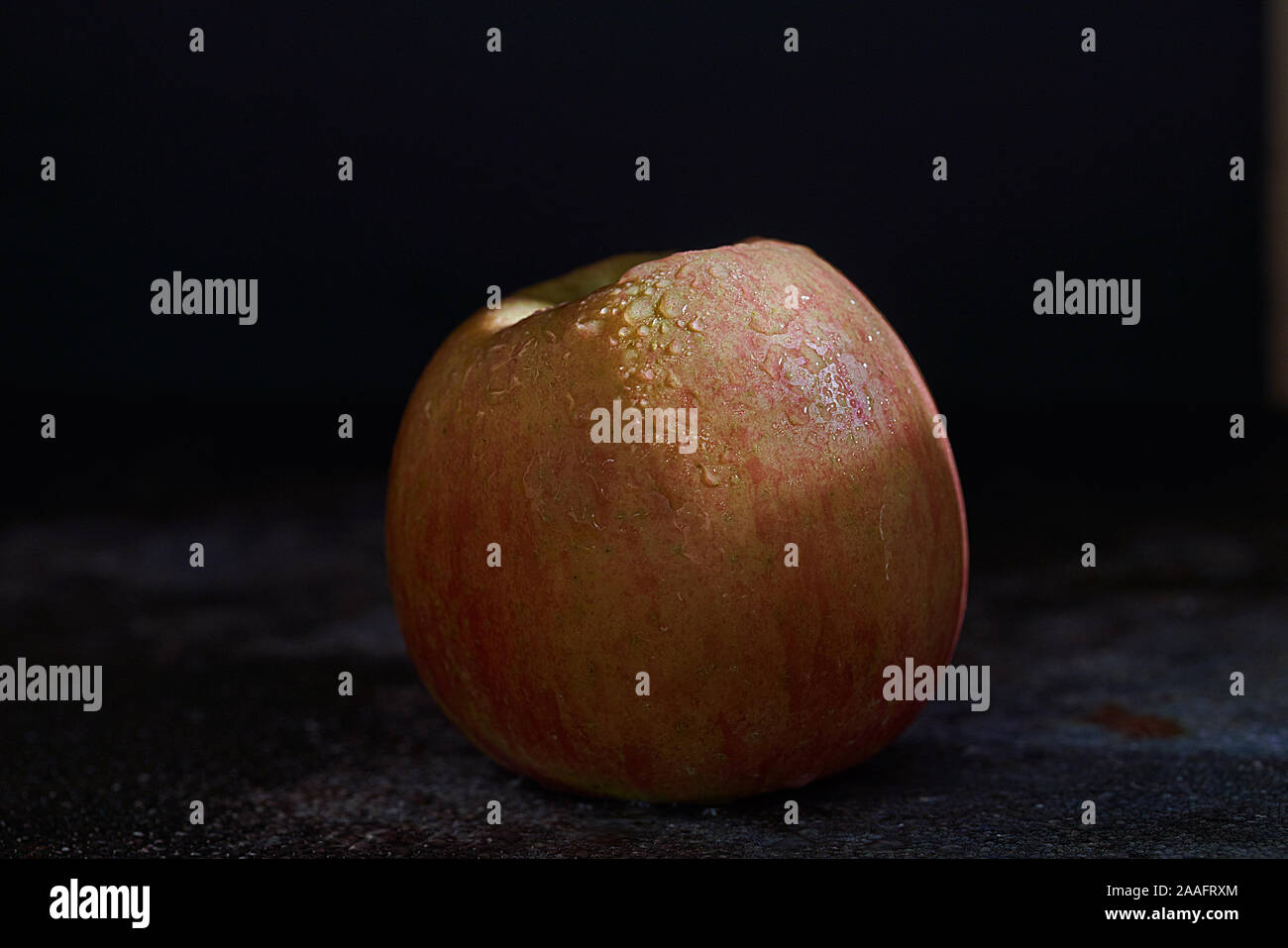 Fuji apple on dark background Stock Photo
