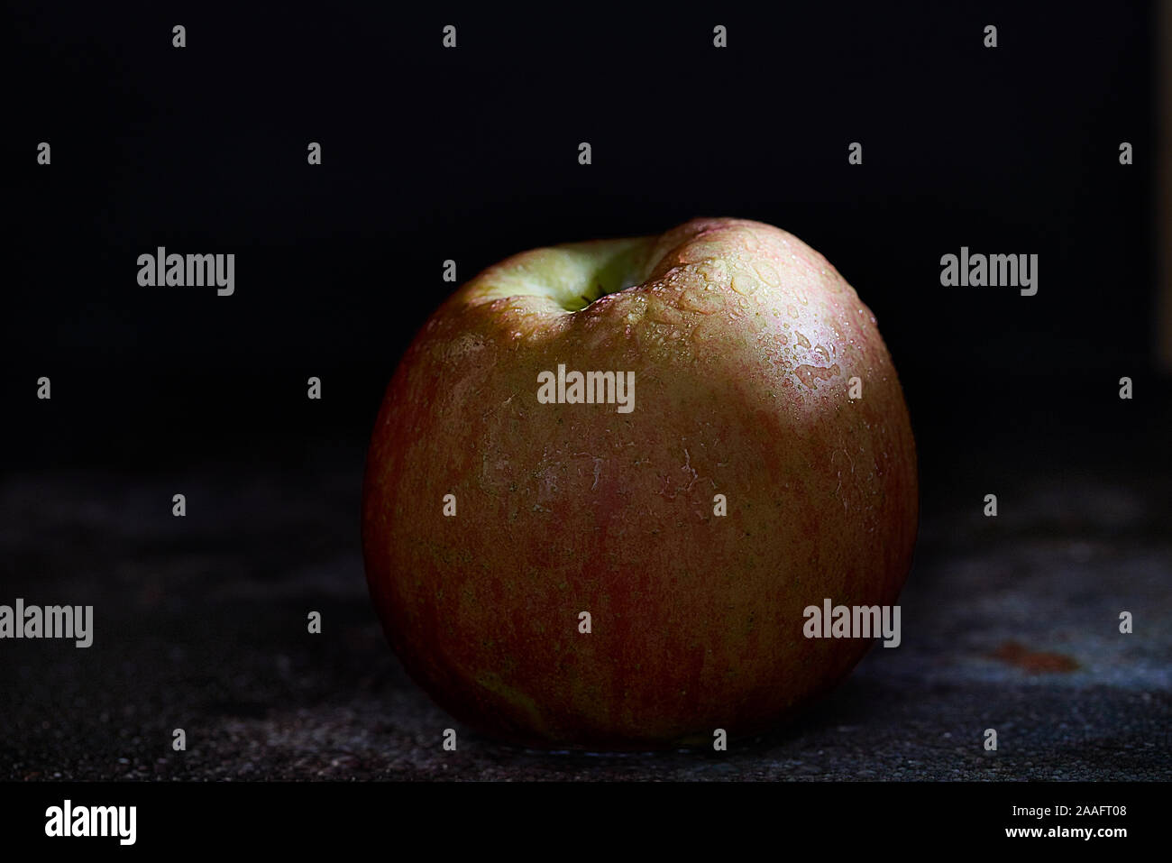 Fuji apple on dark background Stock Photo