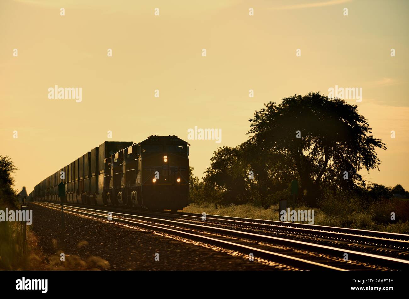 Cortland, Illinois, USA. A Union Pacific freight train approaching Cortland, Illinois shortly before sunset Stock Photo