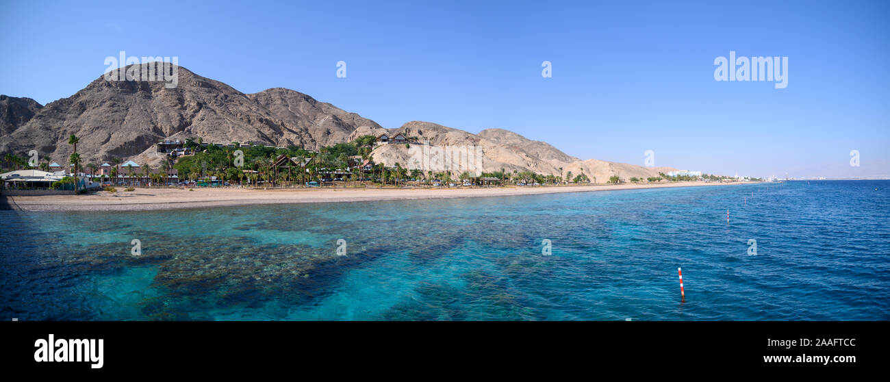 View on coral reef and resort hotels at southern beach of Eilat city aerial view shot from the sea Stock Photo