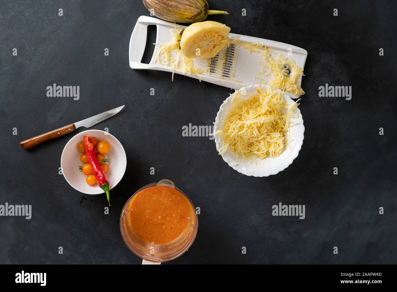 process of making and cooking the cut zucchini pasta spaghetti on the
