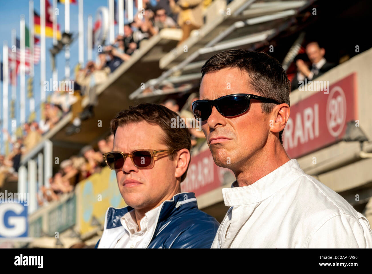 Carroll Shelby played by Matt Damon and Ken Miles played by Christian Bale from Ford v Ferrari (2019 directed by James Mangold. True story of their battle to build a car for Ford to challenge the dominance of Ferrari at Le Mans for the 1966 24 hour race. Stock Photo