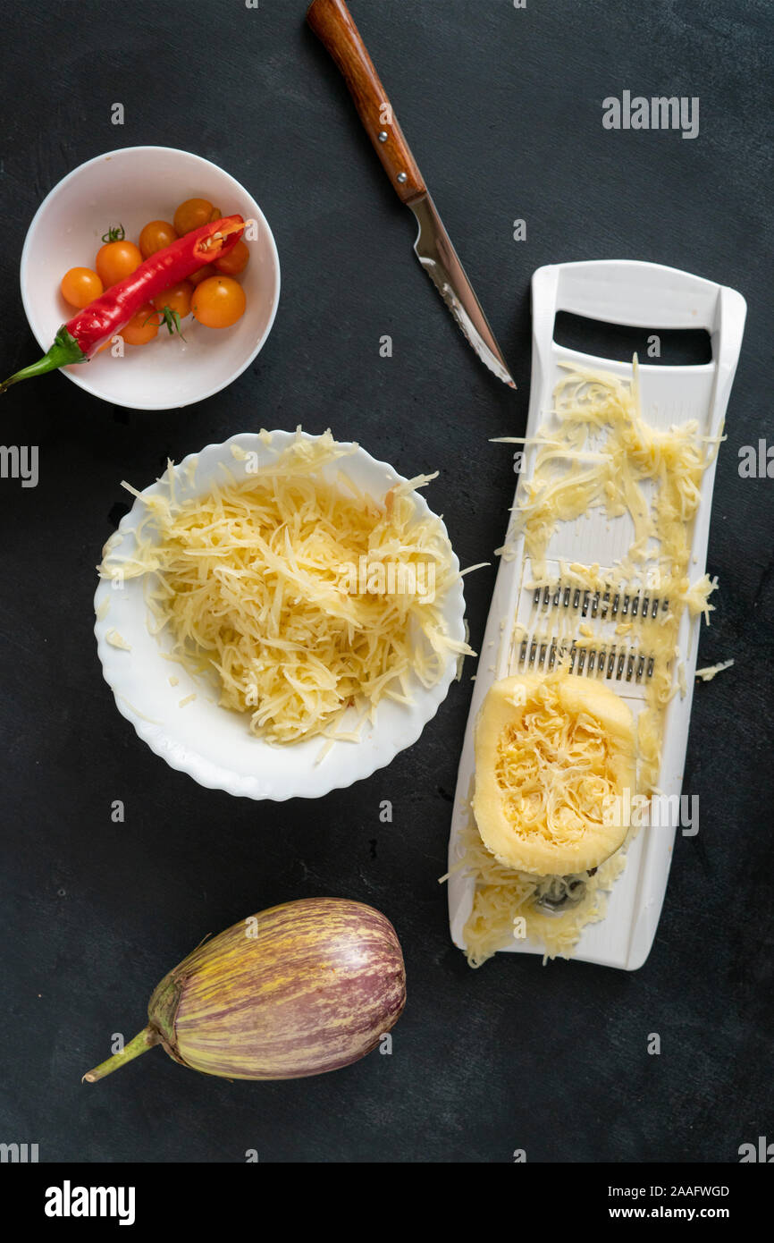 process of making and cooking the cut zucchini pasta spaghetti on the