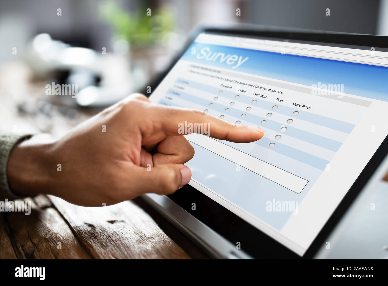 Close-up Of A Businessman Filling Survey On Laptop At Workplace Stock ...