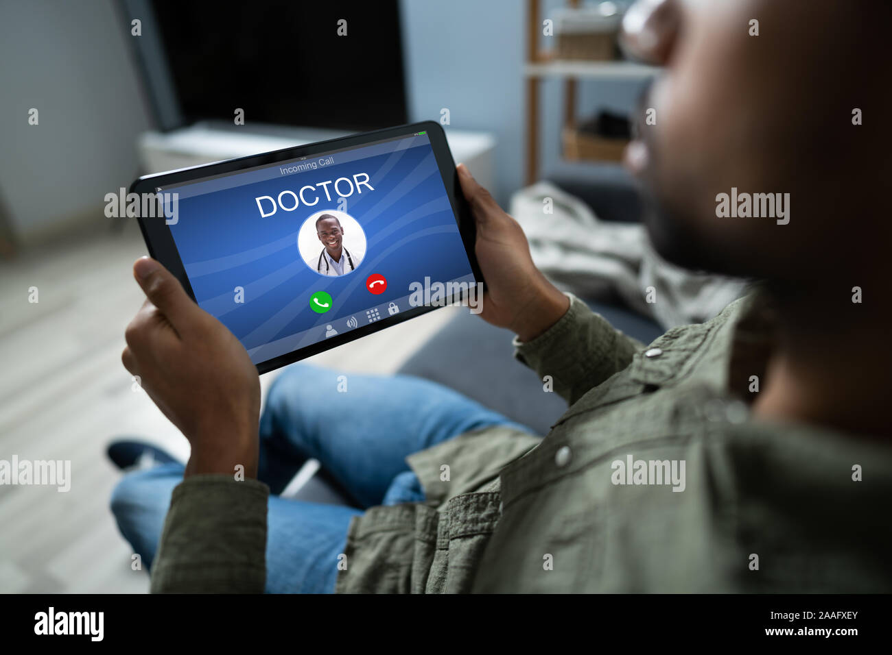 Tablet Incomig Calling Close-up Of A Man's Hand Holding Digital Tablet With Doctor's Incoming ...