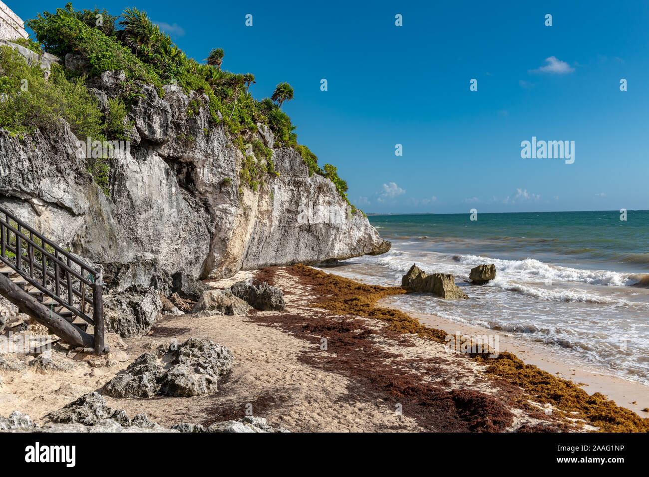 Beautiful beach in Tulum Mexico, Mayan ruins on top of the cliff. Stock Photo